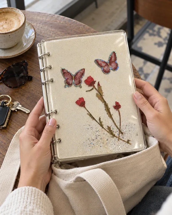 Butterflies notebook cover taken out of a tote bag